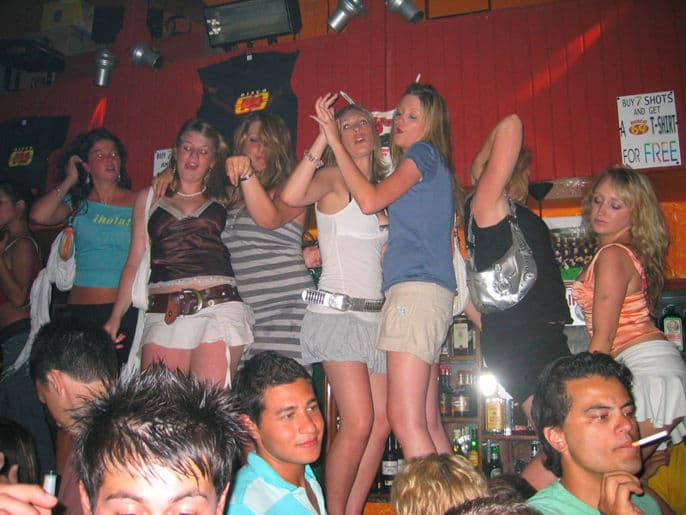 Crowd dancing under the lights at Disco 69